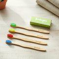 Pack of 4 bamboo toothbrushes for adults with included cotton buds