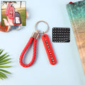 Anti-lost keychain with number plate displayed on white background