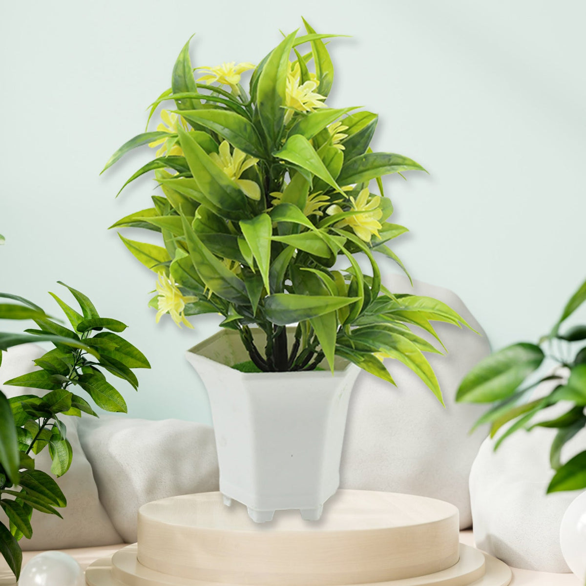 Bright artificial plant with yellow flowers adorning a sunny windowsill.